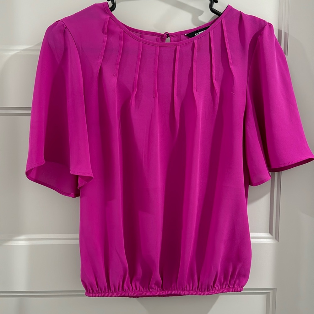 Beautiful Magenta blouse. In great shape and very lightweight and comfortable.